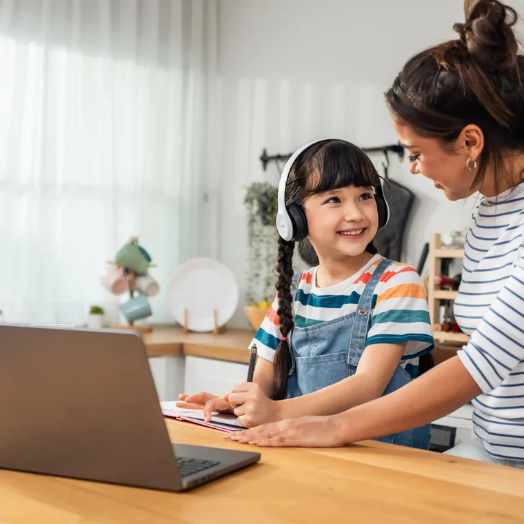 Students and families working at laptops